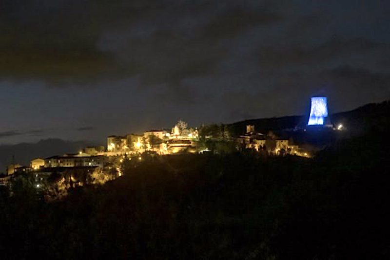 Dressing geothermal cooling tower in light for the Christmas period in Italy