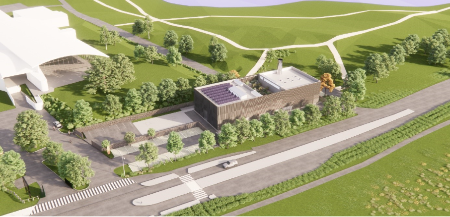GeoBrie heating plant | ThinkGeoEnergy - Geothermal News & Insights Aerial view of a modern brick building surrounded by trees, roads, and pedestrian crosswalks in a landscaped campus model.
