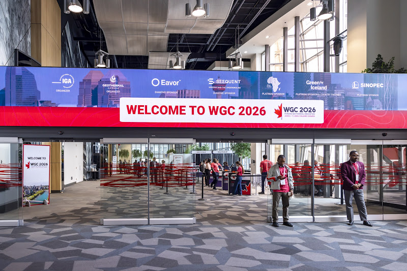 WGC welcome | ThinkGeoEnergy - Geothermal News & Insights Conference lobby entrance with a large banner that reads 'WELCOME TO WGC 2026' and people at the check-in area.